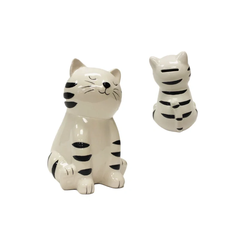 WHITE AND BLACK STRIPED CLOSED-EYED CAT MONEY BANK